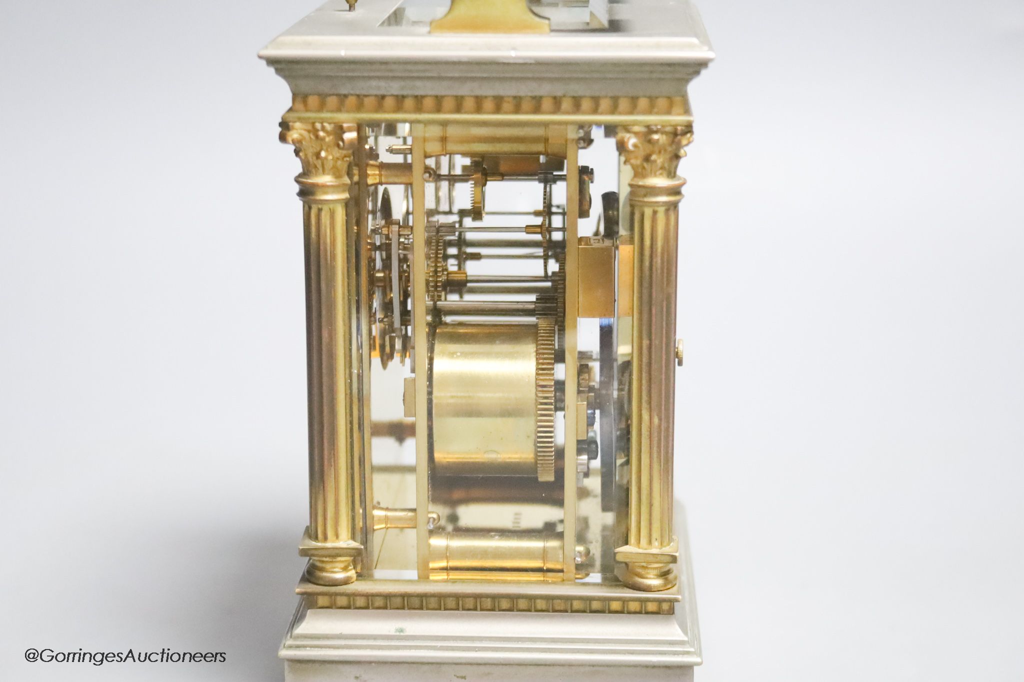 A silvered and gilt brass Corinthian pattern carriage clock, height 17cm